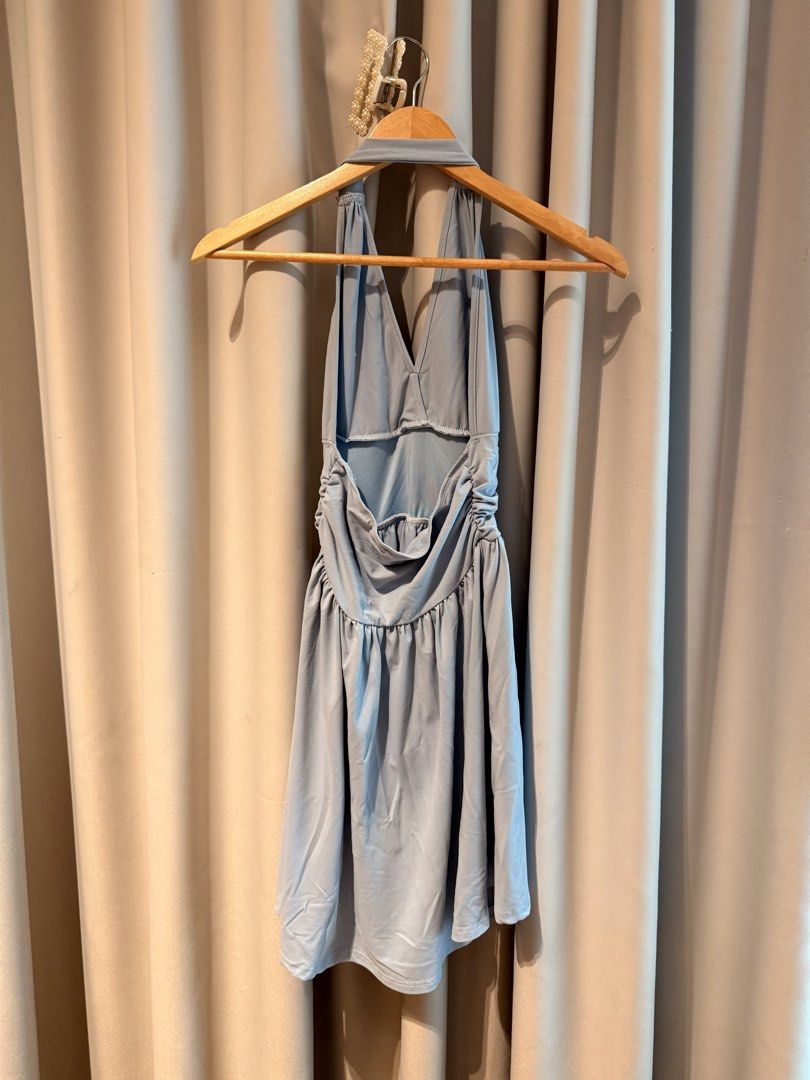 Light blue halter neck mini skater dress open back (Category: Dresses) located in Taguig. Submitted by regalbbb (Listing ID 1470755380, Image 2). Description: RFS: Decluttering Condition: Used two times and no flaws. Shein sizes run big so this fits xs-s - Color: Light blue - Style: Halter neck skater dress with deep V-neck and open back - Fit: Wide waistband with a flattering flared, pleated skirt - Material: Soft stretch fabric.