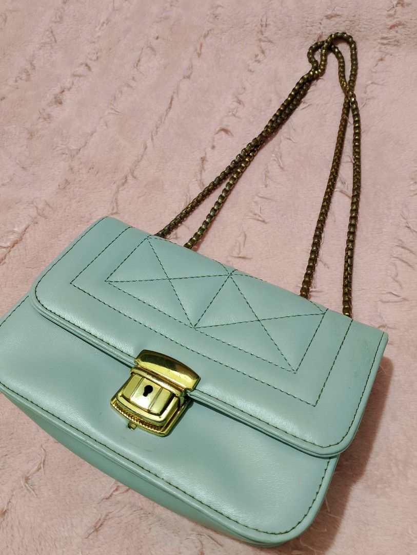 Light Blue Quilted Crossbody/Shoulder Bag with Chain Strap (Category: Shoulder Bags) located in Quezon City. Submitted by ivriory.wolfie (Listing ID 1470869081, Image 1). Description: Color: Pastel blue with dark brown interior lining Design: Quilted panel detail on the flap with secure lock closure and antique finish link chain strap Interior: Features a handy slip pocket for small essentials Condition: Clean and well-maintained all around .