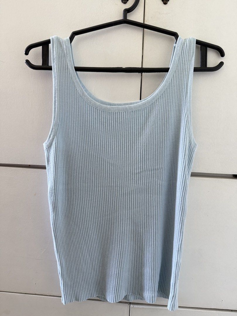 Light blue ribbed tank top scoop neck (Category: Sleeveless) located in Manila. Submitted by mnlclaudia (Listing ID 1470790487, Image 1). Description: - Color: Light blue - Material: Soft, stretchy ribbed knit - Design: Scoop neckline with wide straps - Fit: Body-hugging and easy to style - Condition: Clean fabric, no stains or loose threads.