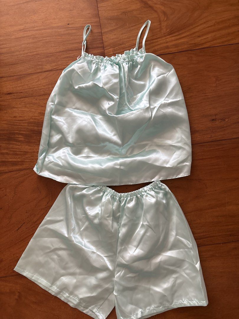 Light blue satin cami and shorts pajama set (Category: Undergarments & Loungewear) located in Manila. Submitted by damburgurt (Listing ID 1470800665, Image 1). Description: Sold as SET - Color: Light blue with a soft, silky sheen - Set includes: Camisole top and matching shorts - Details: Ruffle neckline with a sweet front bow - Fit: Relaxed fit with an easy elastic waistband - Material: Lightweight satin for ultimate lounging comfort.
