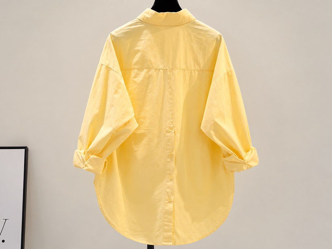 Light Yellow Oversized Button-Down Shirt (Category: Shirts) located in Kawit. Submitted by summer.731 (Listing ID 1470767910, Image 2). Description: - Color: Light yellow with contrast white collar - Fit: Oversized, relaxed, slouchy fit - Details: Single left chest pocket, high-low curved hem - Sleeves: Long sleeves (can be worn rolled up) - Style: Casual, chic button-down shirt.
