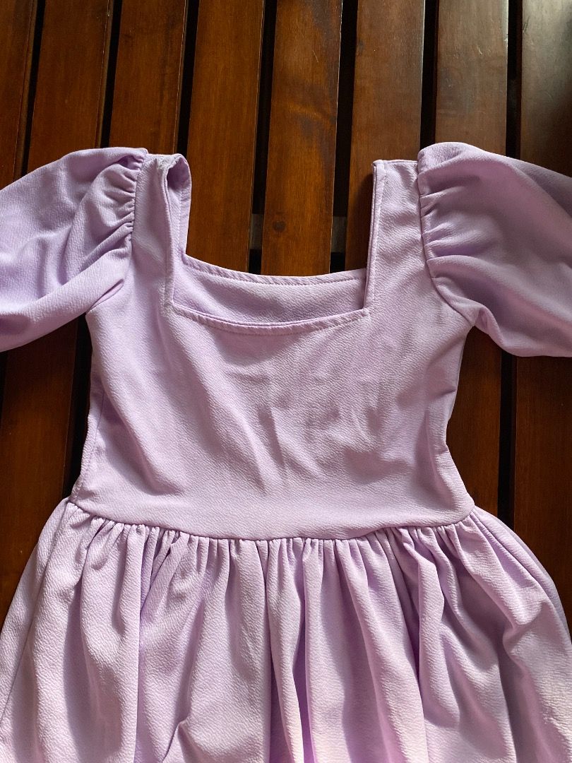 Lilac Square Neck Ruffle Dress (Category: Dresses) located in Pateros City. Submitted by strawberhyun (Listing ID 1470815528, Image 2). Description: - Color: Lilac - Style: Mini dress with fitted bodice and flared skirt - Details: Short puff sleeves, square neckline, and bottom ruffle tier - Fabric: Textured and comfortable - Perfect for: Casual days out and casual dates - Small to Medium.