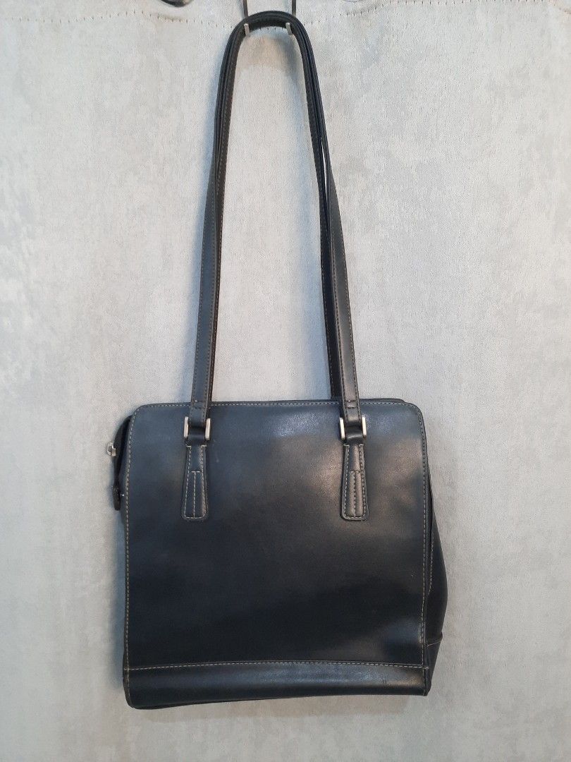 Liz Claiborne Black Leather Shoulder Bag (Category: Shoulder Bags) located in Marilao. Submitted by mariealeiah (Listing ID 1470752223, Image 1). Description: - Brand: Liz Claiborne - Color: Classic black exterior with a vibrant red fabric interior - Material: Premium leather with stylish contrast stitching - Straps: Comfortable long dual straps - Hardware: Sleek silver-tone accents - Storage: Structured rectangular shape with multiple internal c