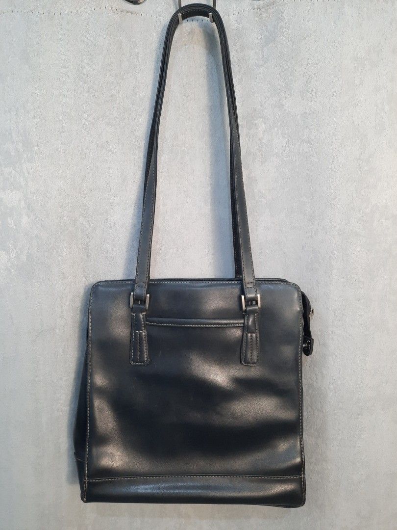 Liz Claiborne Black Leather Shoulder Bag (Category: Shoulder Bags) located in Marilao. Submitted by mariealeiah (Listing ID 1470752223, Image 3). Description: - Brand: Liz Claiborne - Color: Classic black exterior with a vibrant red fabric interior - Material: Premium leather with stylish contrast stitching - Straps: Comfortable long dual straps - Hardware: Sleek silver-tone accents - Storage: Structured rectangular shape with multiple internal c