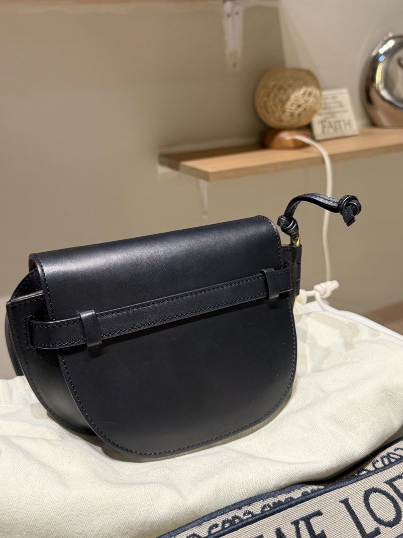 Loewe Gate Bag Black Leather Crossbody (Category: Cross-body Bags) located in Manila. Submitted by closetbynight (Listing ID 1470853056, Image 3). Description: -Loewe Mini Gate Bag leather body adjustable flat leather strap front flap with knotted leather strap closure interior slip pockets Complete with dust bag and original strap + slim strap I bought outside. Condition: EXCELLENT 9.8/10. I barely use this only during events. RFS: decluttering 