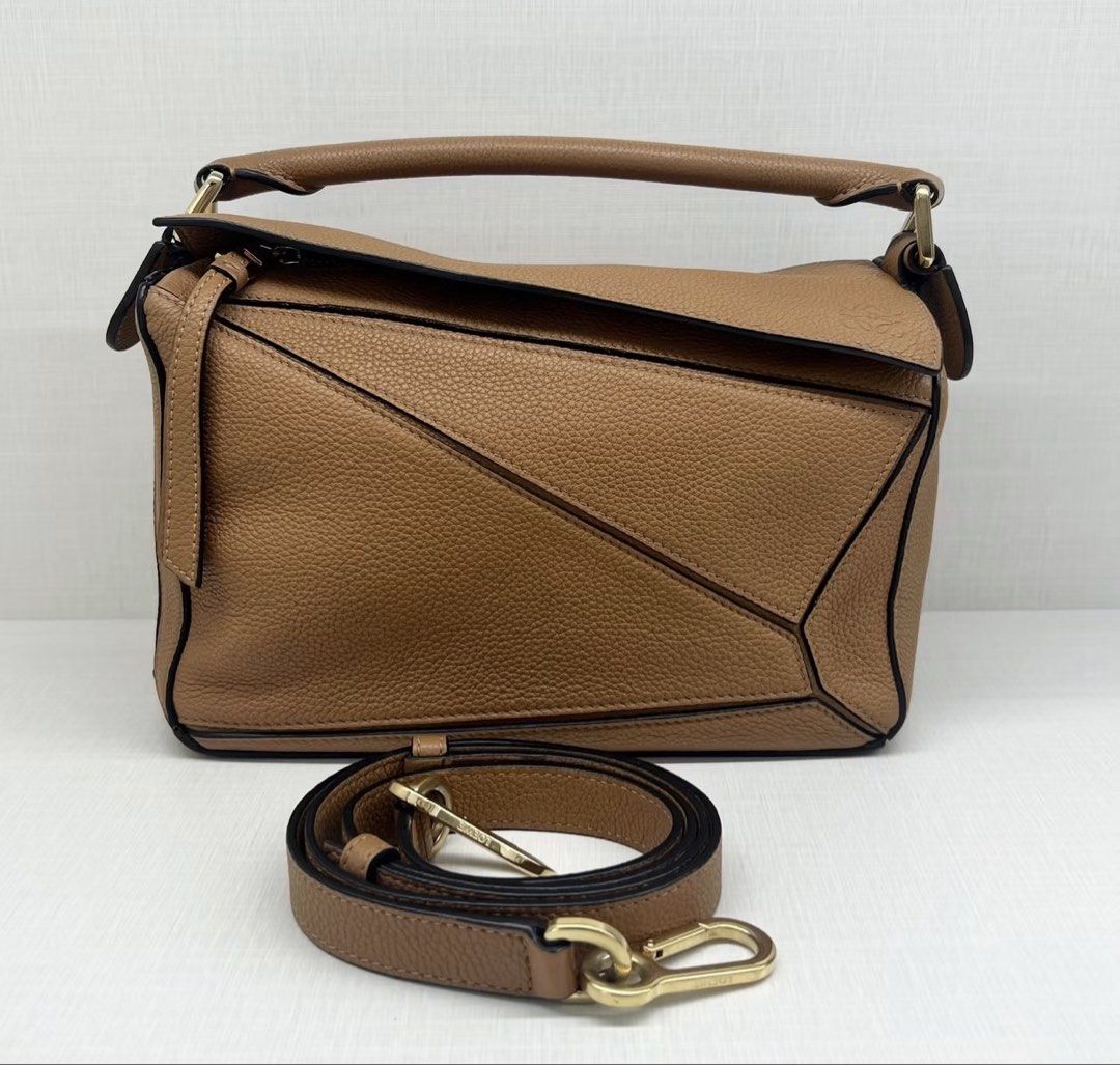 LOEWE puzzle small grained caramel (Category: Luxury Bags & Wallets) located in Tagaytay City. Submitted by eg_gallery (Listing ID 1470832326, Image 1). Description: guaranteed authentic / strap, bag organizer.