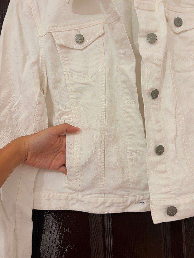 LOFT White Denim Jacket Size M (Category: Coats, Jackets and Outerwear) located in Marikina City. Submitted by _bananahanaa (Listing ID 1470802539, Image 3). Description: - Brand: LOFT - Item: White denim jacket - Size: Medium (M), fits small also - Design: Classic button-up front with branded metallic buttons - Pockets: Chest flap pockets and side slip pockets.