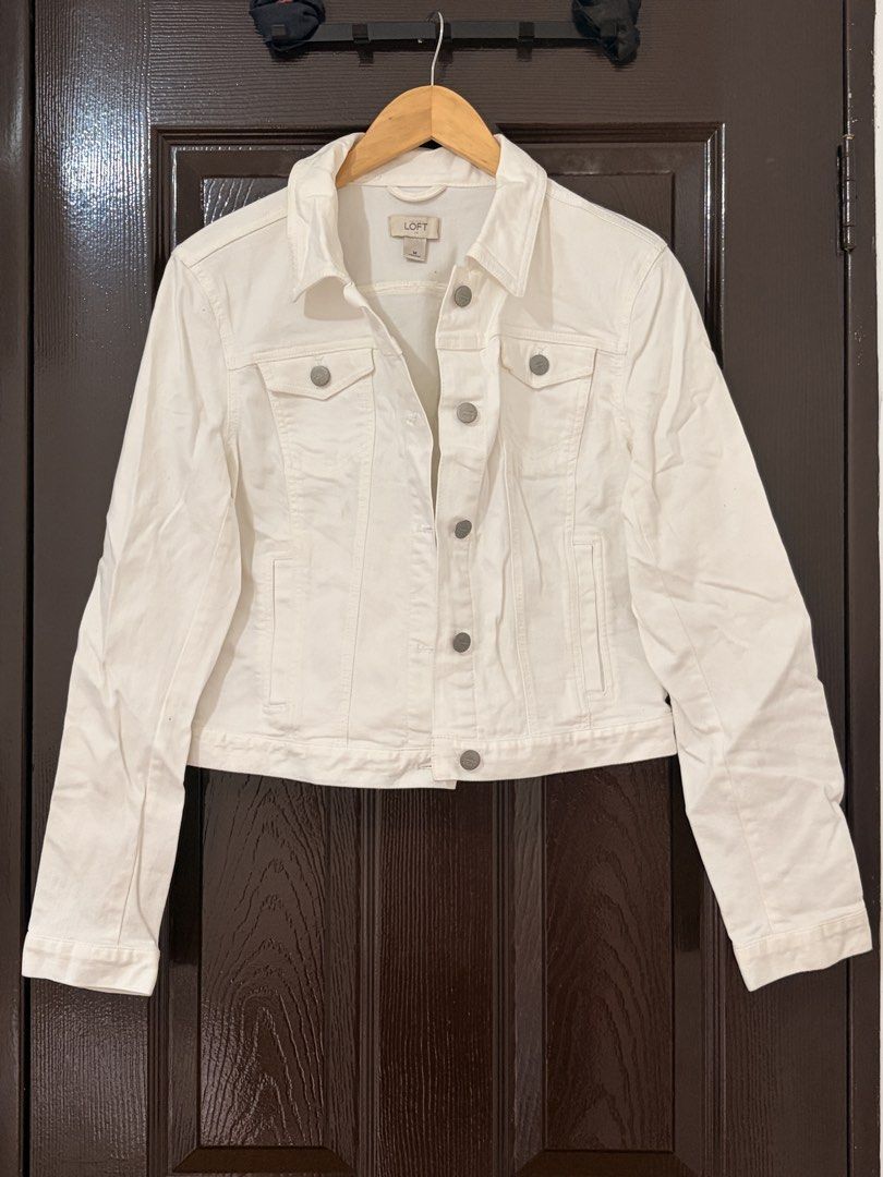 LOFT White Denim Jacket Size M (Category: Coats, Jackets and Outerwear) located in Marikina City. Submitted by _bananahanaa (Listing ID 1470802539, Image 1). Description: - Brand: LOFT - Item: White denim jacket - Size: Medium (M), fits small also - Design: Classic button-up front with branded metallic buttons - Pockets: Chest flap pockets and side slip pockets.