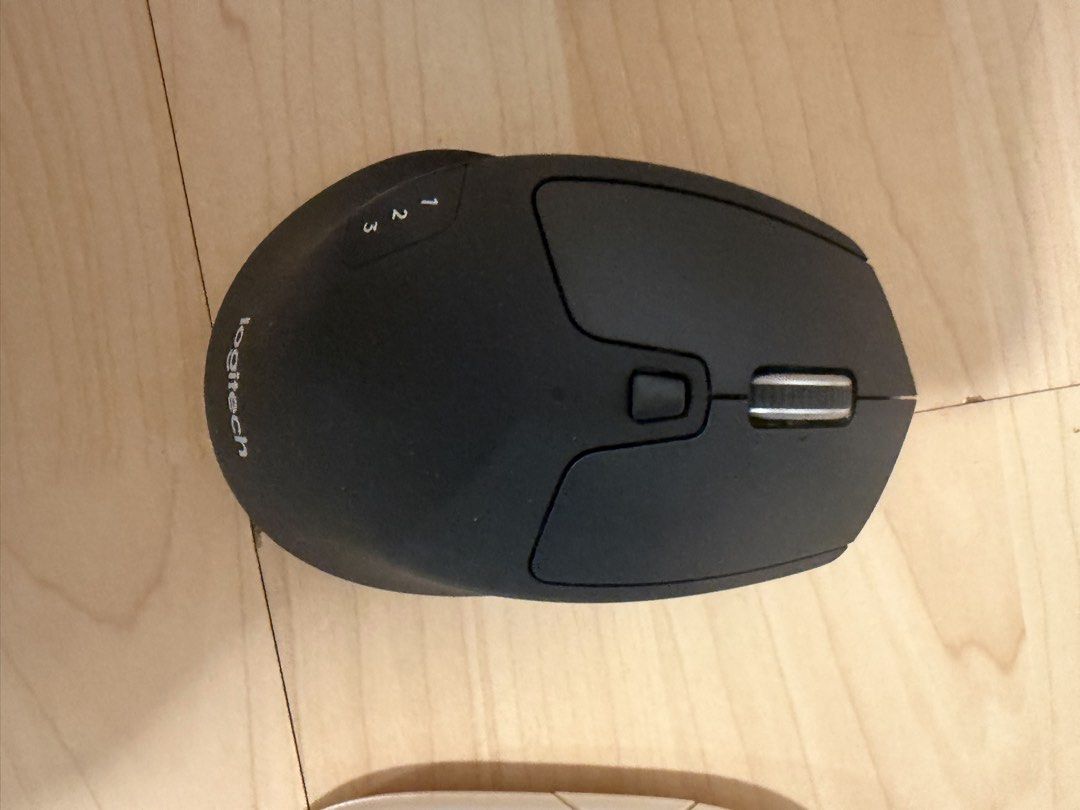 Logitech Multi-Device Wireless Mouse (Category: Mouse & Mousepads) located in Singapore. Submitted by katiehouse1 (Listing ID 1470838880, Image 1). Description: - Model: Logitech wireless mouse in matte black - Multi-device connectivity: Easily switch between computers using side buttons 1, 2, and 3 - Design: Ergonomic shape with a comfortable thumb rest and metallic scroll wheel - Condition: Clean and 100% ready to connect.