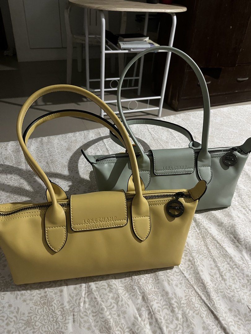 Longchamp Le Pliage Extra Small Handbag Yellow and Mint Green (Category: Luxury Bags & Wallets) located in Manila. Submitted by mightywater.250f83 (Listing ID 1470845546, Image 2). Description: - Authentic Longchamp handbags available in 2 colors: Yellow and Mint Green - Condition: Clean, hardly used, and well-maintained - Features: Secure zipper closure with button flap snap and double top handles - Interior: Clean black jacquard fabric lining w