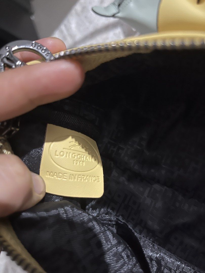Longchamp Le Pliage Extra Small Handbag Yellow and Mint Green (Category: Luxury Bags & Wallets) located in Manila. Submitted by mightywater.250f83 (Listing ID 1470845546, Image 3). Description: - Authentic Longchamp handbags available in 2 colors: Yellow and Mint Green - Condition: Clean, hardly used, and well-maintained - Features: Secure zipper closure with button flap snap and double top handles - Interior: Clean black jacquard fabric lining w