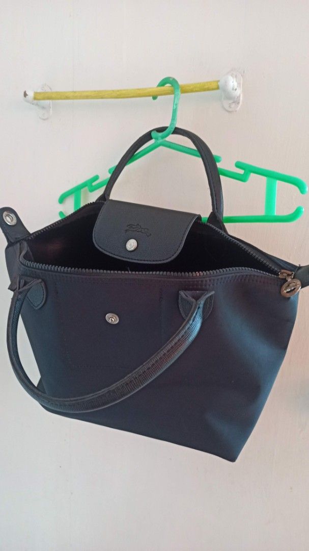 Longchamp Le Pliage Nylon Tote Bag Black (Category: Luxury Bags & Wallets) located in Santa Teresita. Submitted by icecandy2.0 (Listing ID 1470820565, Image 1). Description: - Longchamp Le Pliage tote bag in classic black - Made with durable, water-resistant nylon and stylish dark leather handles/flap - Secure zip top closure with a front snap button - Spacious interior to easily fit your daily essentials, laptop, or makeup pouch - Lightweight, f