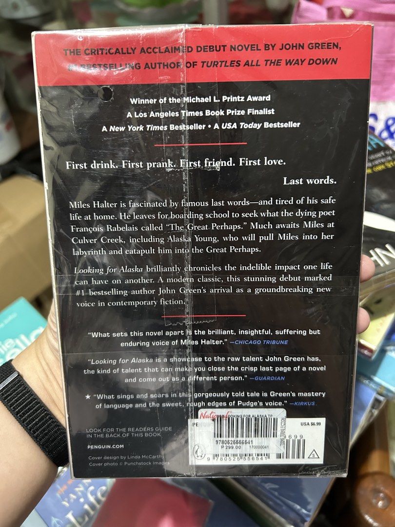 Looking for Alaska by John Green paperback novel (Category: Storybooks) located in San Pedro. Submitted by hyunmiso (Listing ID 1470928549, Image 2). Description: - Title: Looking for Alaska by John Green - Format: Paperback (Classic smoke cover design) - Condition: Brand new, still sealed in plastic - Accents: Walmart price sticker on front cover, pristine inside pages - Accolades: Printz Award Winner & New York Times Bestseller - Genre: Young A