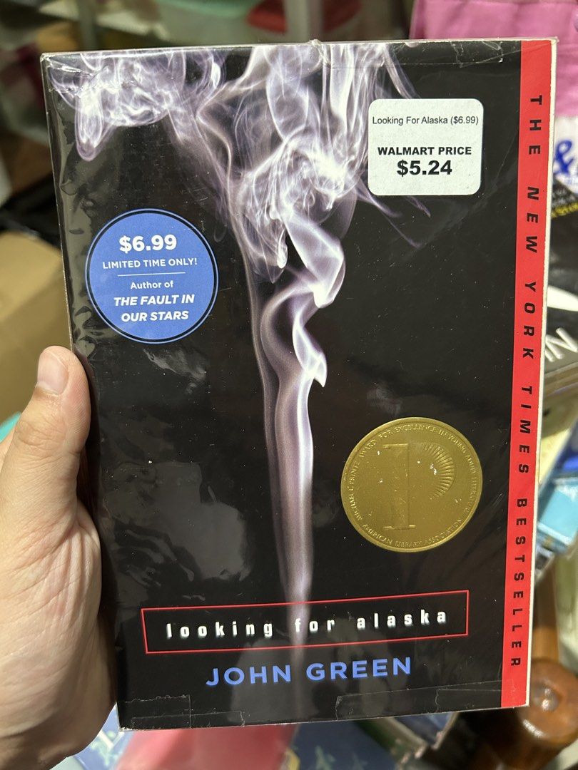 Looking for Alaska by John Green paperback novel (Category: Storybooks) located in San Pedro. Submitted by hyunmiso (Listing ID 1470928549, Image 1). Description: - Title: Looking for Alaska by John Green - Format: Paperback (Classic smoke cover design) - Condition: Brand new, still sealed in plastic - Accents: Walmart price sticker on front cover, pristine inside pages - Accolades: Printz Award Winner & New York Times Bestseller - Genre: Young A