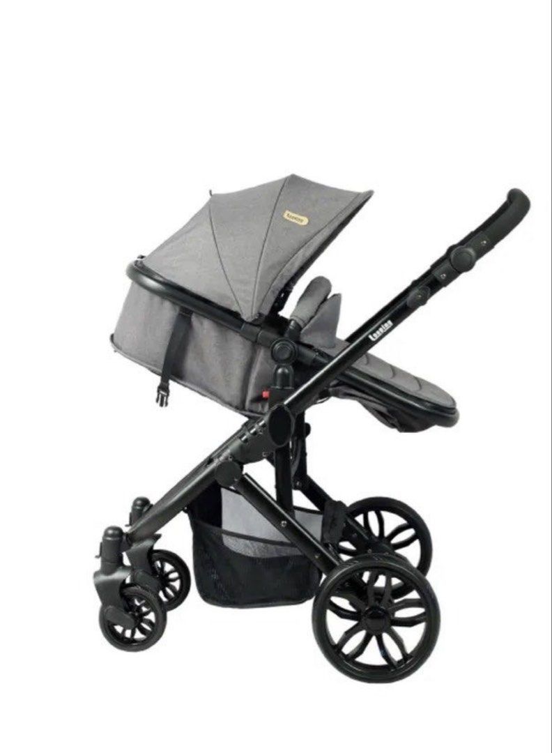 Looping Sydney stroller (Category: Strollers) located in Makati City. Submitted by akimoie (Listing ID 1470852210, Image 1). Description: - Color: Dark grey and black fabric - Wheels: Large wheels with white rims for smooth rides on rough pavement - Suspension: Visible red suspension springs for added comfort - Canopy: Large foldable canopy to block the sun - Storage: Spacious bottom basket for bags and gear - Handlebar: Comfortable foam-wrapped 