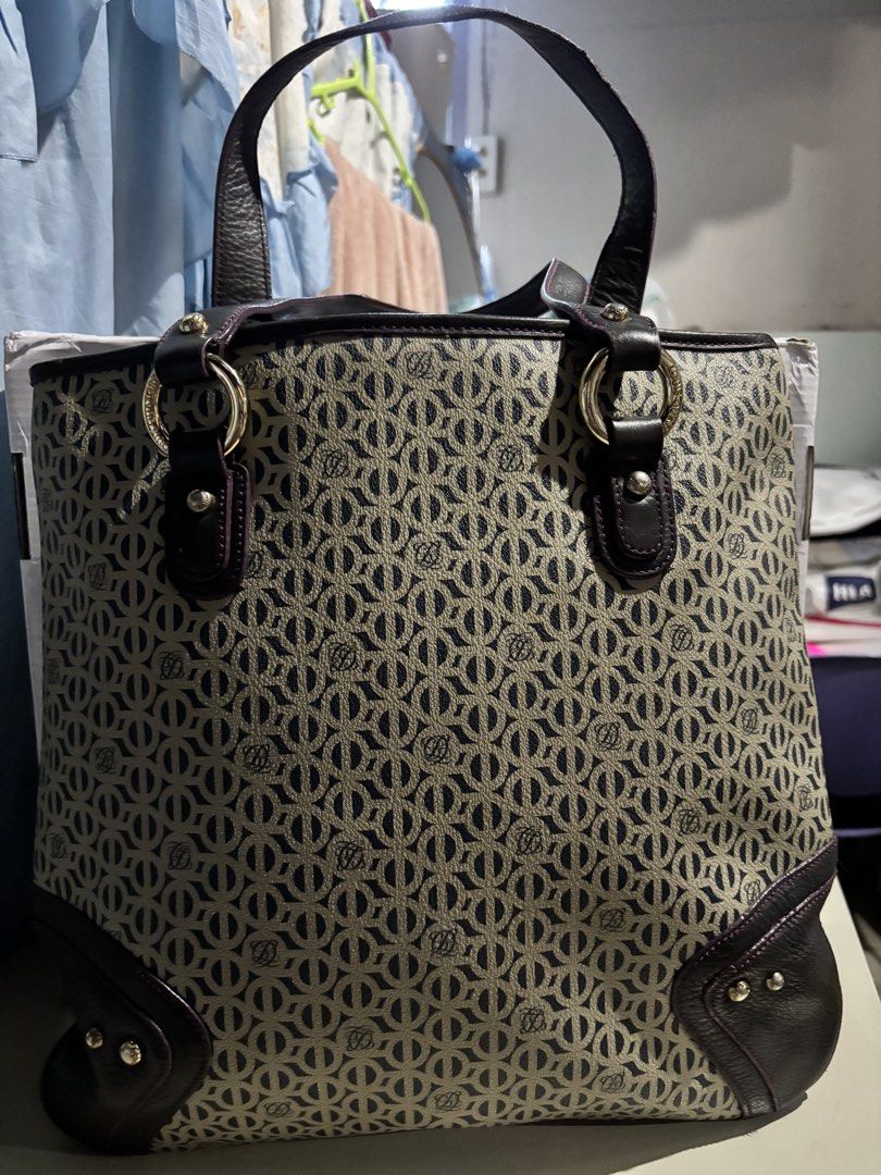 Louis Quatorze Monogram Tote Bag Dark Brown (Category: Tote Bags) located in Rizal. Submitted by va_nes_sa_ (Listing ID 1470818910, Image 2). Description: - Brand: Louis Quatorze - Style: Monogram Tote Bag (vertical) - Color: Dark Brown with beige monogram, dark brown leather accents and violet trimmings - Hardware: Gold-toned rings, studs, and zipper pull with engraved logo - Interior: Vibrant pink lining with secure zippered main compartment an