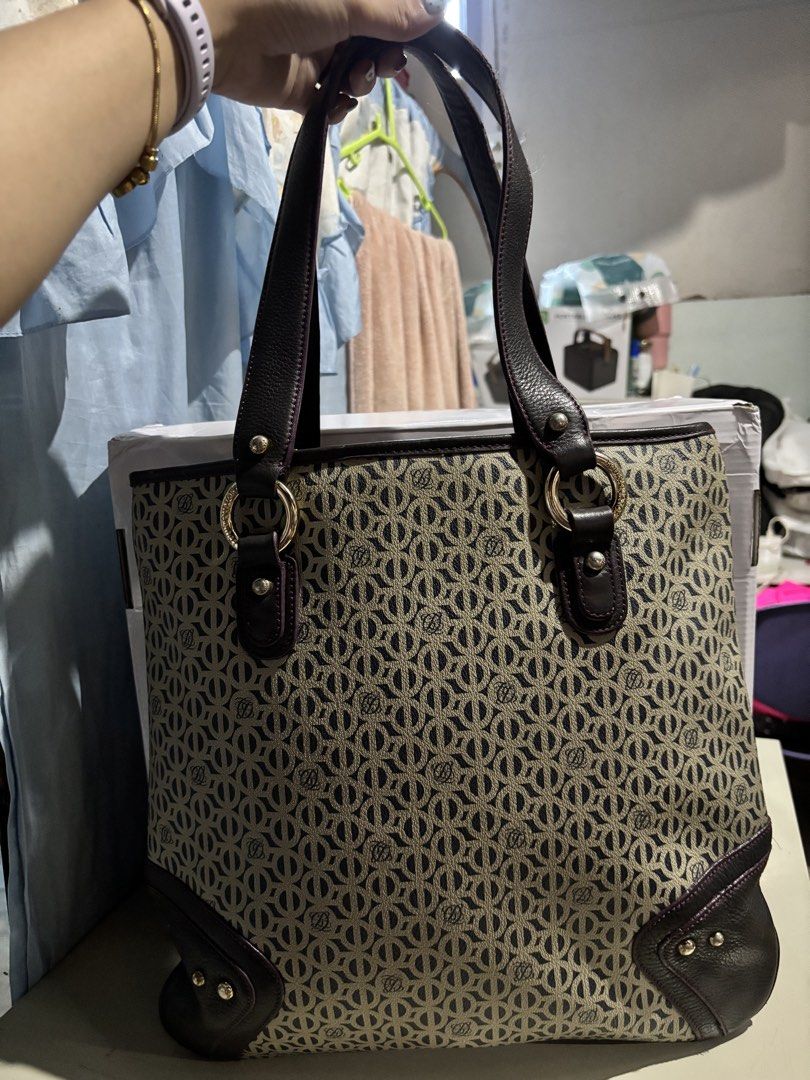 Louis Quatorze Monogram Tote Bag Dark Brown (Category: Tote Bags) located in Rizal. Submitted by va_nes_sa_ (Listing ID 1470818910, Image 1). Description: - Brand: Louis Quatorze - Style: Monogram Tote Bag (vertical) - Color: Dark Brown with beige monogram, dark brown leather accents and violet trimmings - Hardware: Gold-toned rings, studs, and zipper pull with engraved logo - Interior: Vibrant pink lining with secure zippered main compartment an
