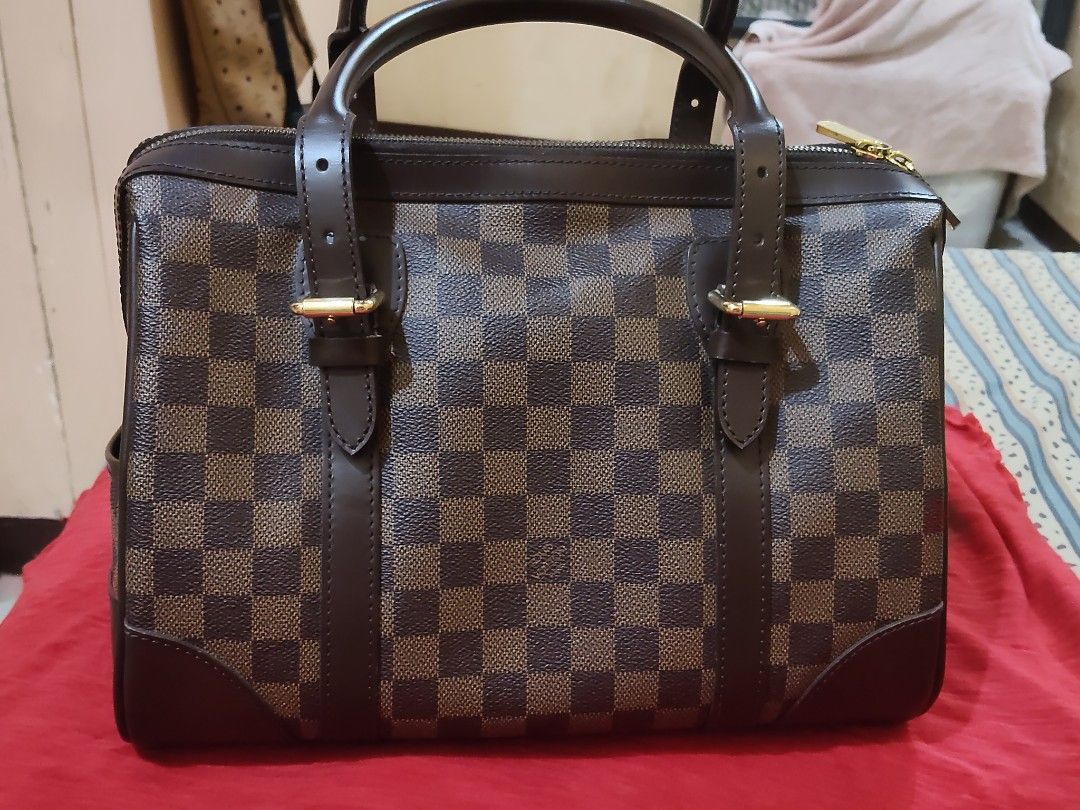 Louis Vuitton Damier Ebene Handbag (Category: Luxury Bags & Wallets) located in Cebu City. Submitted by almzcorner (Listing ID 1470781690, Image 3). Description: - Authentic Louis Vuitton handbag in timeless Damier Ebene canvas - Elegant dark brown leather trim and polished brass hardware - Secure zip top closure with dual engraved zipper pulls - Features the prominent gold-tone Louis Vuitton Inventeur plaque on the front - Clean, structured shap