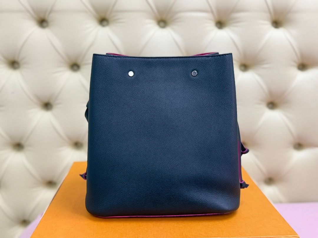 LOUIS VUITTON Lockme Bucket (Category: Luxury Bags & Wallets) located in Famy. Submitted by azgeda (Listing ID 1470852882, Image 3). Description: Color: Noir/Hot Pink Rarely used --------- Inclusions: box dustbag -------- Asking price is listed Accepting Offers.