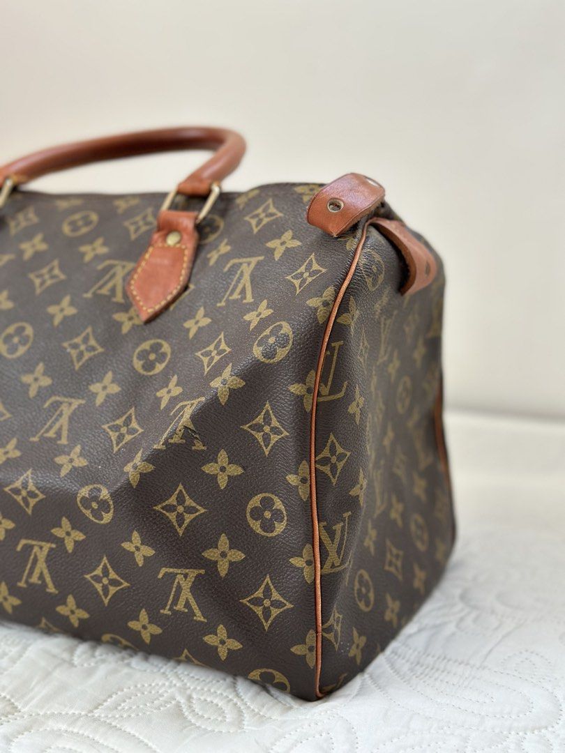 Louis Vuitton Monogram Speedy Handbag (Category: Luxury Bags & Wallets) located in Batangas. Submitted by enyahsnivl56498 (Listing ID 1470887809, Image 1). Description: Louis Vuitton Monogram Duffel Bag - Dimensions: Approximately 30cm across - Material: Classic brown coated canvas with Vachetta leather trim - Hardware: Brass zipper closure and details - Condition: Normal signs of use on leather handles and piping, with a beautifully darkened pat