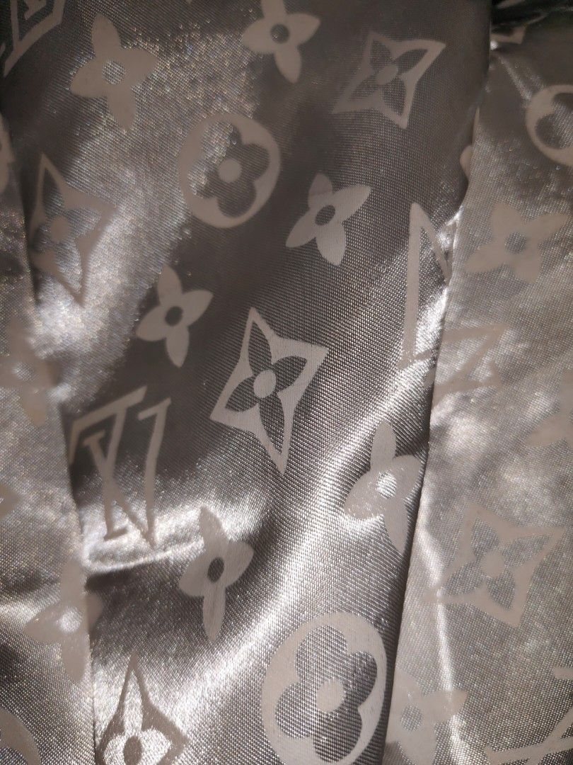 Louis Vuitton Monogram White Satin Button-Up Shirt (Category: Luxury Apparel) located in Bulacan. Submitted by heathersdream.c0 (Listing ID 1470806805, Image 2). Description: XS-M - Color: White with subtle tonal LV monogram pattern - Material: Smooth and shiny satin fabric - Design: Classic collar with front button closure - Sleeves: Long sleeves - Hem: Curved hemline - Style: Chic, stylish, and great for casual or formal wear.