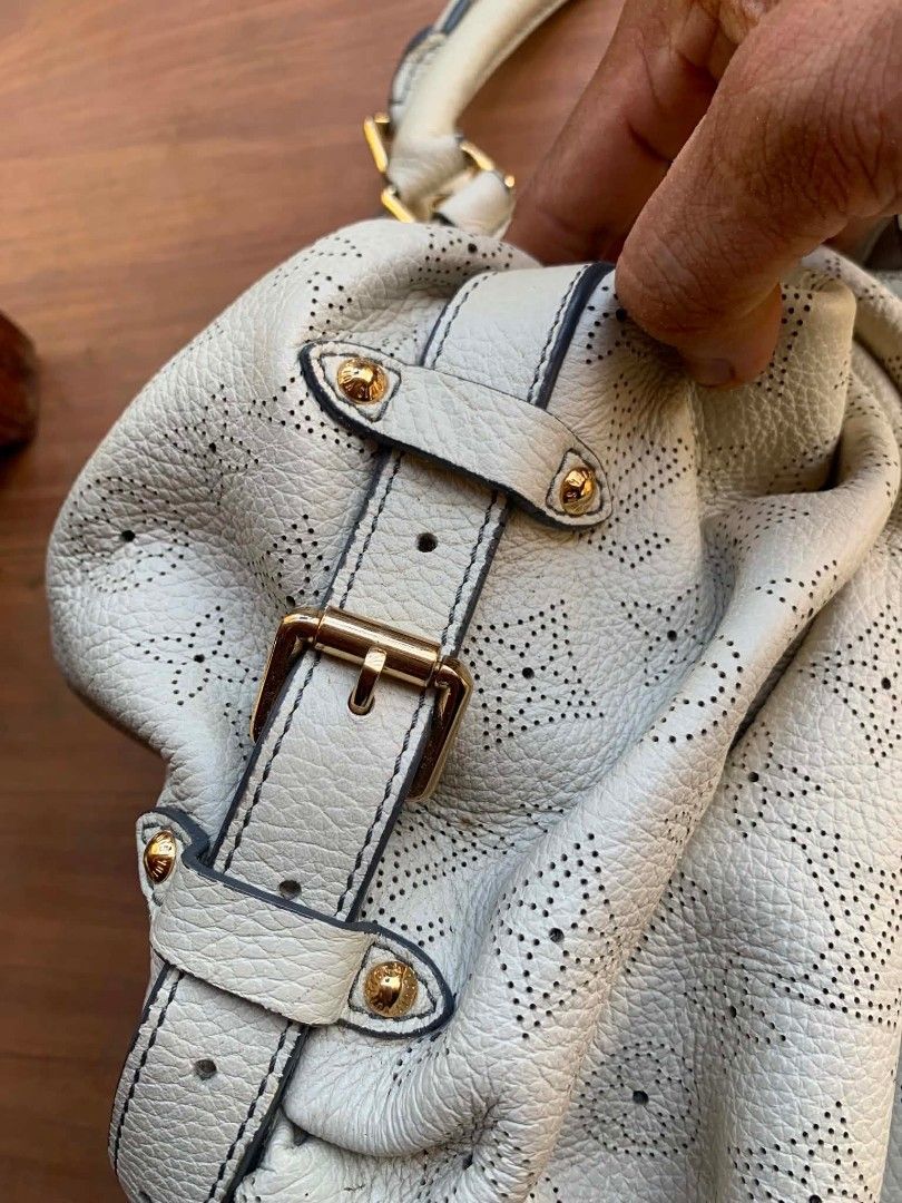 Louis Vuitton Perforated Leather Bag (Category: Luxury Bags & Wallets) located in Gingoog City. Submitted by talianjeri27046 (Listing ID 1470884697, Image 3). Description: - Brand: Louis Vuitton - Material: White perforated leather with iconic monogram pattern - Hardware: Gold-tone front clasp and side buckles - Interior: Single compartment with zippered pocket and embossed leather tag (Louis Vuitton Paris Made in France) - Strap: Single shoulder