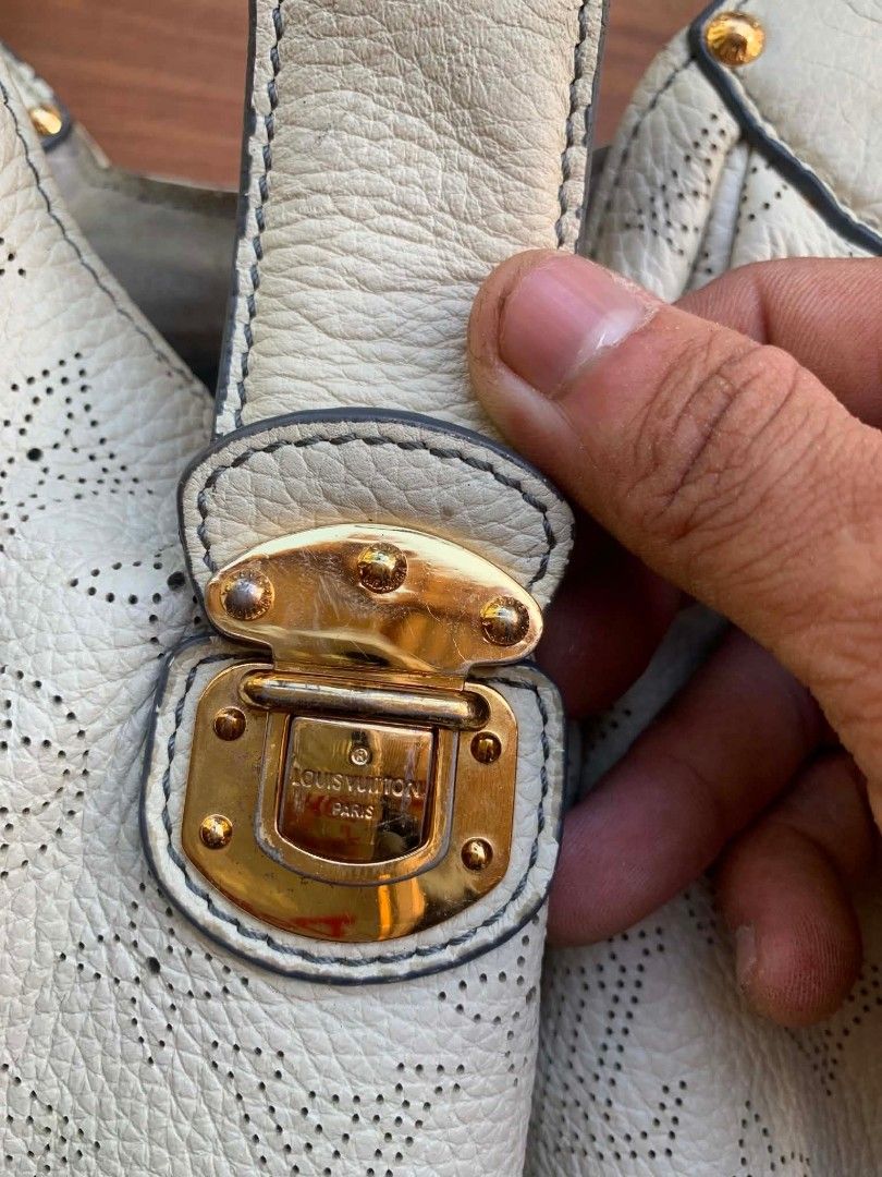 Louis Vuitton Perforated Leather Bag (Category: Luxury Bags & Wallets) located in Gingoog City. Submitted by talianjeri27046 (Listing ID 1470884697, Image 2). Description: - Brand: Louis Vuitton - Material: White perforated leather with iconic monogram pattern - Hardware: Gold-tone front clasp and side buckles - Interior: Single compartment with zippered pocket and embossed leather tag (Louis Vuitton Paris Made in France) - Strap: Single shoulder
