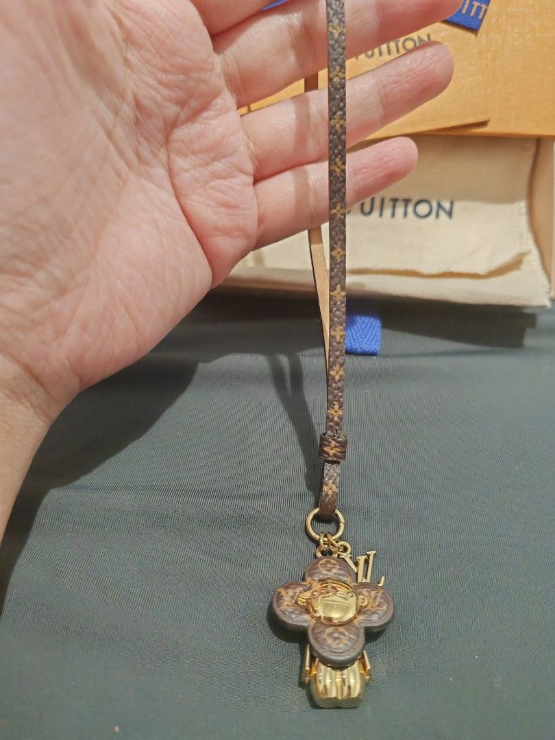 Louis Vuitton Vivienne Mascot Bag Charm Monogram (Category: Charms) located in Quezon City. Submitted by sashasarisarishoppe (Listing ID 1470871145, Image 2). Description: - Brand: Louis Vuitton Vivienne bag charm - Features: Monogram canvas strap with gold-tone hardware - Inclusions: Complete with receipt, original box, and dust pouch - Use: Great accessory for bags or keys or phone charm - With receipt, bought in LV store in Malaysia for 33k+ i