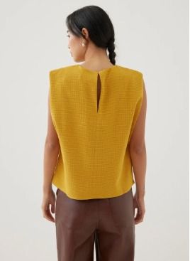 Love Bonito - Axel Tweed Shell Top (Category: Sleeveless) located in San Fernando. Submitted by despicadaaaale (Listing ID 1470907058, Image 2). Description: - Brand: Love Bonito - Brand New - Bought for PHP 2,100.00 - Selling for PHP 1,300.00 - Color: Vibrant Yellow - Design: Textured pattern with structured shoulder pads - Neckline: Classic crew neck with back keyhole button closure - Fit: Straight hem, hits around the hips - Styling: Great to 