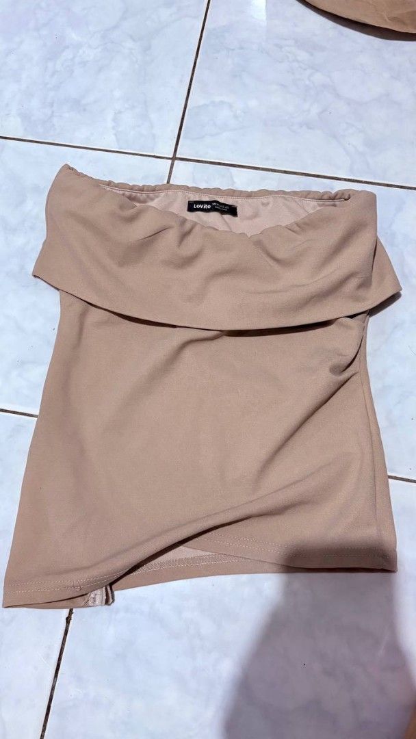 Lovito Beige Off-Shoulder Tube Top Size (Category: Sleeveless) located in Manila. Submitted by jaysieseva620 (Listing ID 1470828138, Image 1). Description: - Brand: Lovito - Color: Neutral Beige - Size: XS (EU 32, US 2), tag attached - Design: Off-shoulder foldover neckline with trendy asymmetrical hem - Fit: Stretchy fabric for a snug, flattering fit - Condition: Brand new with tags - Styling: Perfect for casual day outs or easy layering.