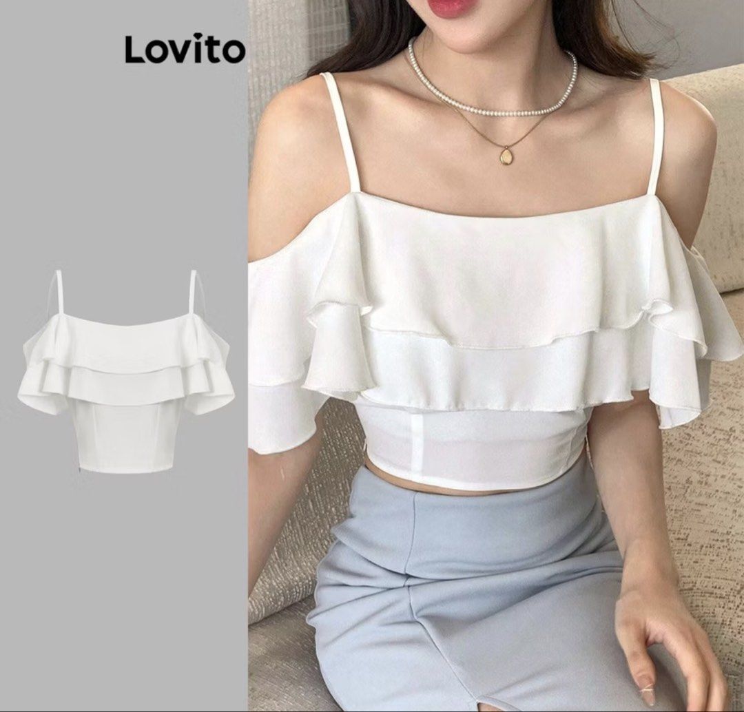 Lovito White Ruffled Cold Shoulder Crop Top (Category: Sleeveless) located in Taguig. Submitted by regalbbb (Listing ID 1470752386, Image 3). Description: RFS: Decluttering Condition: Tried on once and never used - Brand: Lovito - Color: White - Style: Cold shoulder with spaghetti straps and layered front ruffles - Fit: Cropped - Pairing: Easy to match with skirts or high-waisted pants.