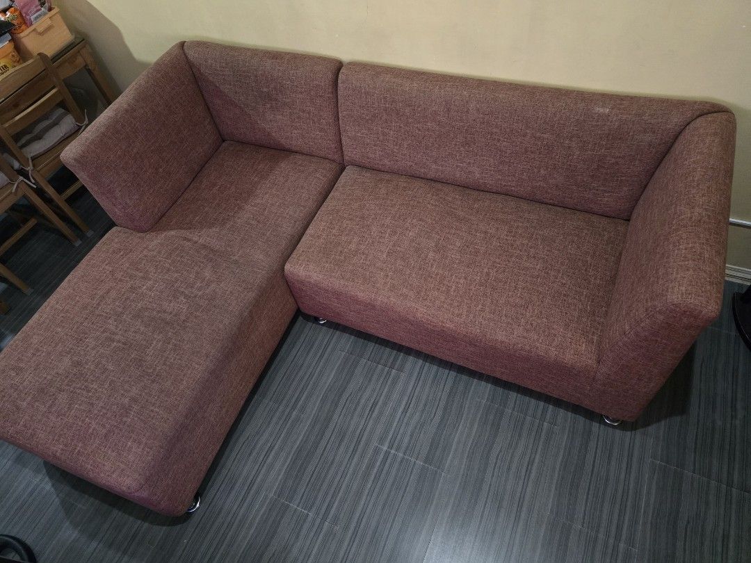 L-shaped Fabric Sofa Brown (Category: Sofas) located in Binan City. Submitted by misscm18 (Listing ID 1470829167, Image 1). Description: 4-Seater L-shaped sofa Used for 5years With minor uneven section but still comfortable to sit and lie down - Color/Fabric: Beautiful brownish textured fabric - Design: L-shaped sectional with a left-side chaise lounge - Comfort: Deep seating layout with rounded armrests on both ends - Base: Elevated with sturdy 