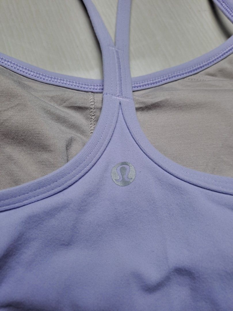 Lululemon Light Purple Top with Built-in Bra (Category: Sleeveless) located in General Santos City (Dadiangas). Submitted by shinra322 (Listing ID 1470768580, Image 3). Description: - Brand: Lululemon - Color: Light Purple - Fit: Slim fit cut with stretchy performance fabric - Support: Built-in bra lining with removable cup slots - Design: Classic racerback strap and reflective logo detail on the back - Cut tag - W15 L26 SX-Small - Add sf.