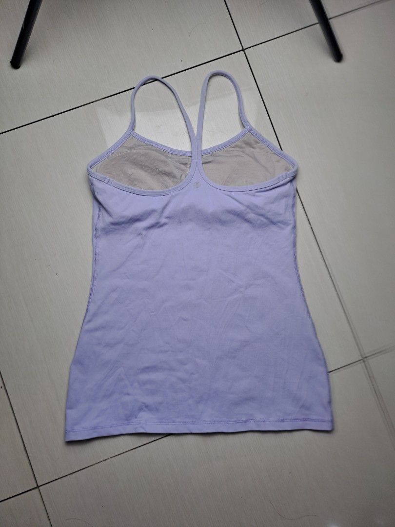 Lululemon Light Purple Top with Built-in Bra (Category: Sleeveless) located in General Santos City (Dadiangas). Submitted by shinra322 (Listing ID 1470768580, Image 2). Description: - Brand: Lululemon - Color: Light Purple - Fit: Slim fit cut with stretchy performance fabric - Support: Built-in bra lining with removable cup slots - Design: Classic racerback strap and reflective logo detail on the back - Cut tag - W15 L26 SX-Small - Add sf.