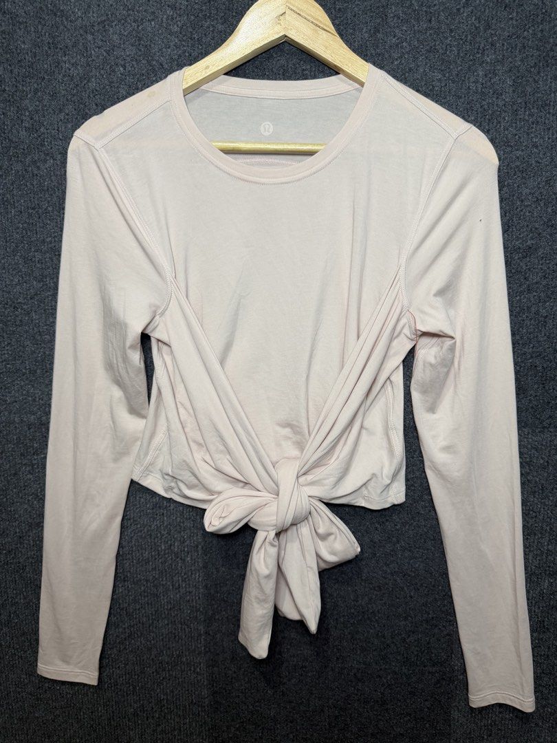 Lululemon Long Sleeve Tie Front Crop Top (Category: Longsleeves) located in Baguio. Submitted by thriftcoded_2600 (Listing ID 1470862490, Image 2). Description: - Lululemon - Excellent Condition - Color rate:10/10 - Size: Small-Medium -16.5x18 -Authentic .
