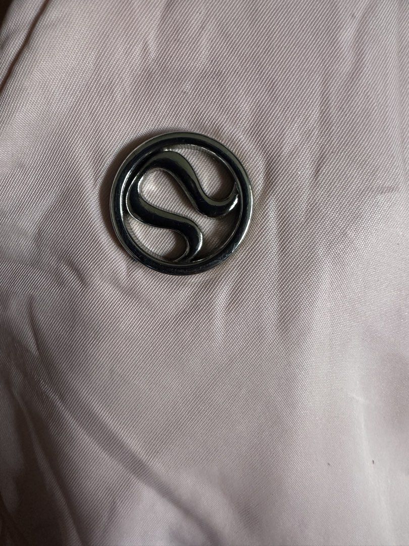Lululemon Pink Shoulder Bag (Category: Shoulder Bags) located in Manila. Submitted by zayzay08 (Listing ID 1470788959, Image 2). Description: - Authentic Lululemon shoulder bag in light pink - Soft and stylish quilted material with metallic logo emblem - Secure zippered top closure and adjustable strap - Handy side slip pockets and smooth pink lining - Dimensions: 29 x 12 cm - Condition: Pristine, clean inside and out -issue need wash.