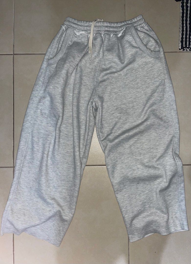 Made in MNL Grey Sweatpants -XL (Category: Joggers) located in Makati City. Submitted by oddbear_e25815 (Listing ID 1470916814, Image 2). Description: - Brand: Made in MNL -SIZE: XL - Color: Grey - Material: Soft fleece lining inside - Fit: Relaxed wide leg fit - Waistband: Elastic with a drawstring closure - Pockets: Deep front pockets - Details: Black brand tag stitched at the back waist - Condition: Clean, no stains or holes.