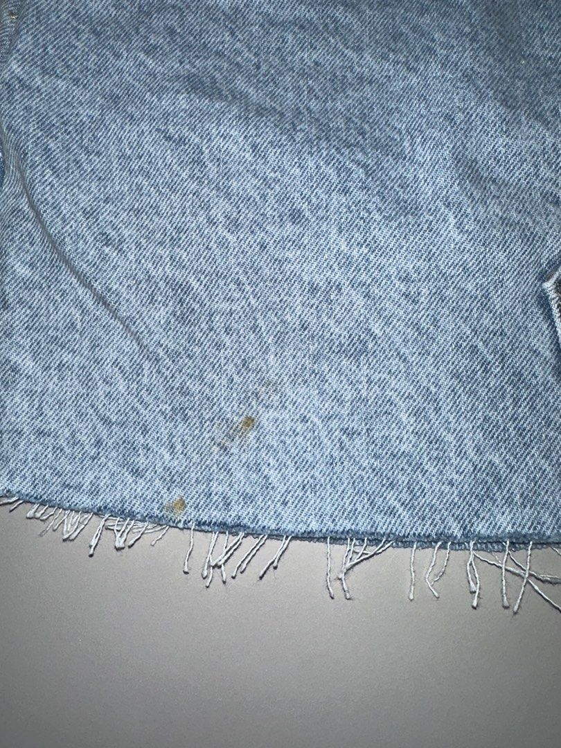 Mango Hailey Denim Skirt XXS (Category: Skirts) located in Antipolo. Submitted by wxyz9876 (Listing ID 1470881025, Image 2). Description: - Brand/Model: Mango Hailey Denim Skirt - Color: Light blue wash - Size: XXS (Fits 24-25 waist) - Details: Raw fringe hem, light distressing, zip fly with button closure, classic 5-pocket styling - Flaws: Small stains near the bottom hem (check close-up photo).