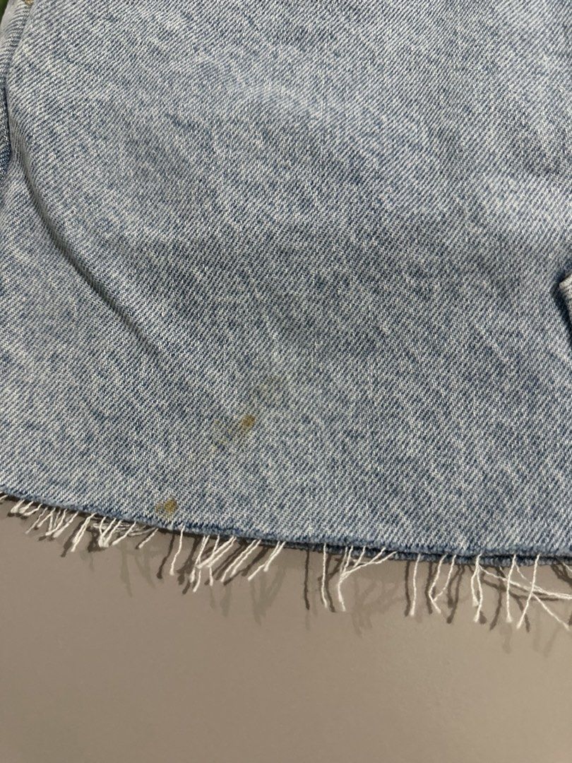 Mango Hailey Denim Skirt XXS (Category: Skirts) located in Antipolo. Submitted by wxyz9876 (Listing ID 1470881025, Image 3). Description: - Brand/Model: Mango Hailey Denim Skirt - Color: Light blue wash - Size: XXS (Fits 24-25 waist) - Details: Raw fringe hem, light distressing, zip fly with button closure, classic 5-pocket styling - Flaws: Small stains near the bottom hem (check close-up photo).