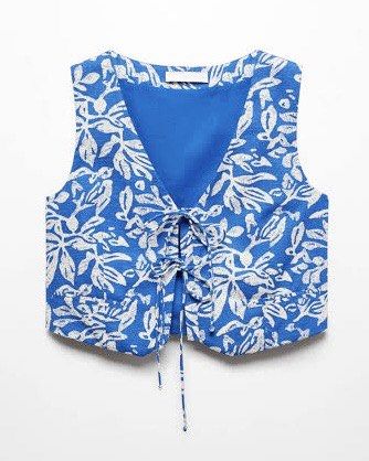 MANGO Waistcoat with Tie (Category: Sleeveless) located in Manila. Submitted by kbrxy (Listing ID 1470850275, Image 2). Description: - Brand: Mango - Size: M - Blue cropped vest with a white floral pattern.