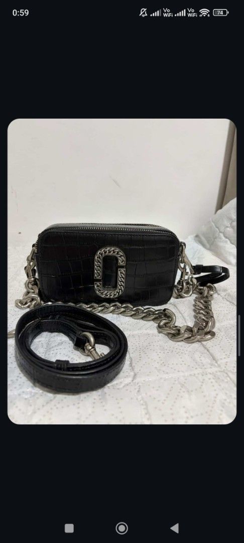 Marc Jacobs Snapshot Croc Embossed Camera Bag (Category: Luxury Bags & Wallets) located in Polomolok. Submitted by legadad94559 (Listing ID 1470809120, Image 2). Description: Marc Jacobs camera bag in black croc-embossed leather - Striking silver chain link J logo and heavy chunky silver shoulder strap - Includes an interchangeable matching black leather strap - Practical dual zipped compartments with a super clean interior and exterior. w/ care 