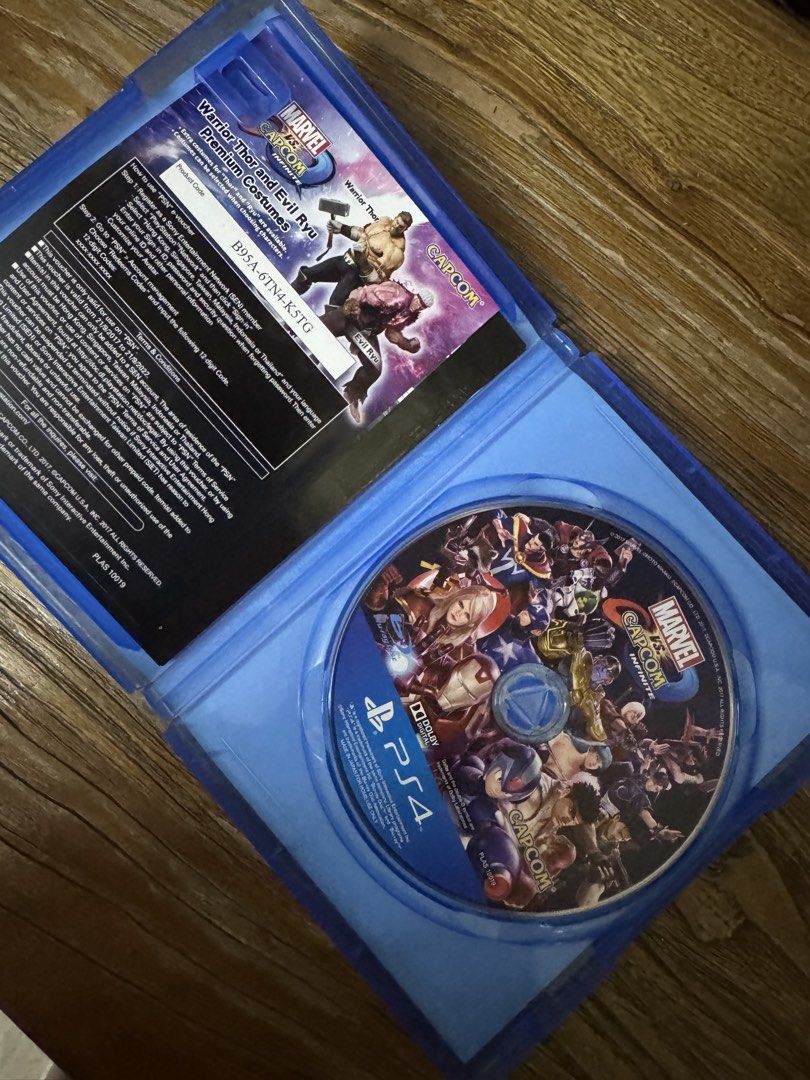 Marvel vs. Capcom: Infinite PS4 Game (Category: PlayStation) located in Las Pinas. Submitted by emdjss (Listing ID 1470817054, Image 2). Description: - Platform: PlayStation 4 (Physical Disc) - Extras: Includes paper insert with unused DLC voucher codes for Warrior Thor and Evil Ryu premium costumes - Genre: Action fighting game featuring iconic Marvel and Capcom characters - Age Rating: Rated 3 .