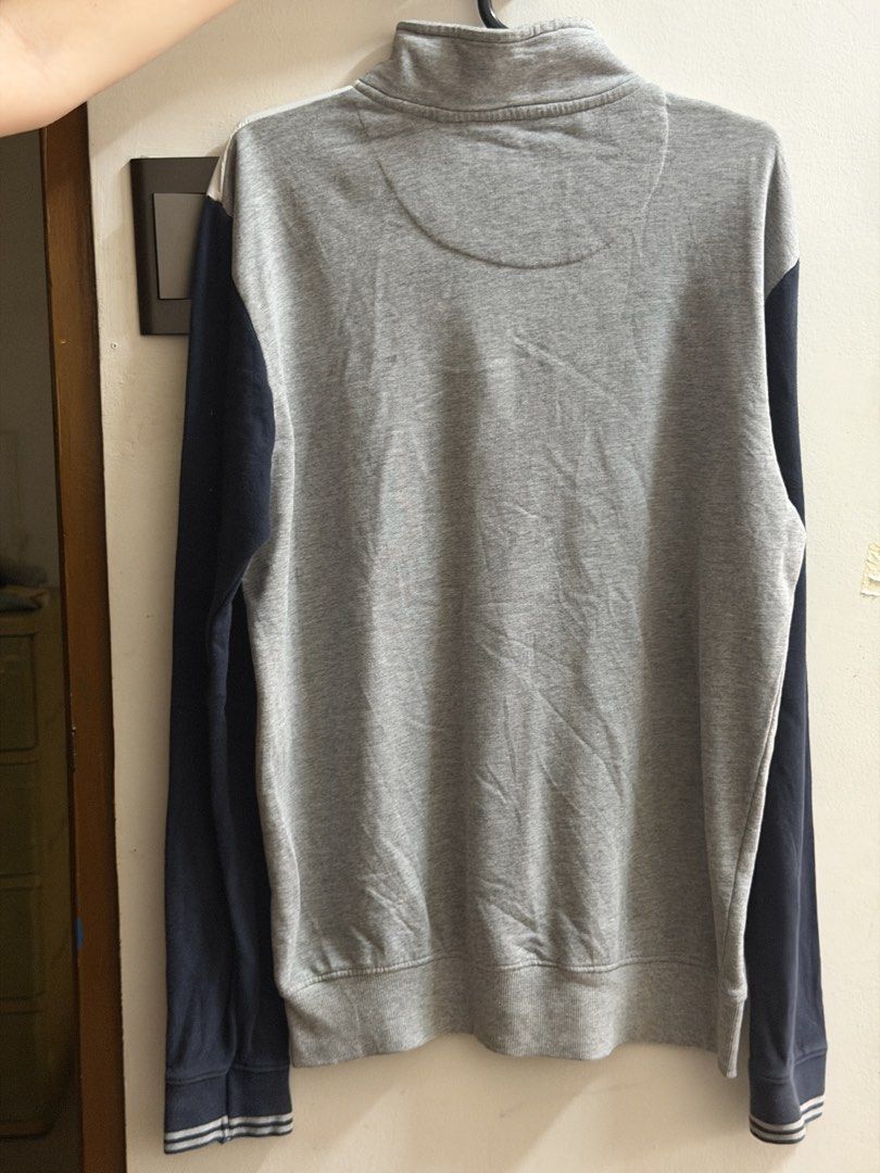 Max Pullover Sweatshirt (Heather Grey & Navy) (Category: Coats, Jackets and Outerwear) located in Bacoor. Submitted by aeieaa (Listing ID 1470782035, Image 2). Description: - High-neck collar with a quarter-zip closure - Sporty colorblock panel styling - Ribbed striped wrist cuffs - Soft and breathable fabric, great for daily smart-casual wear or layering.