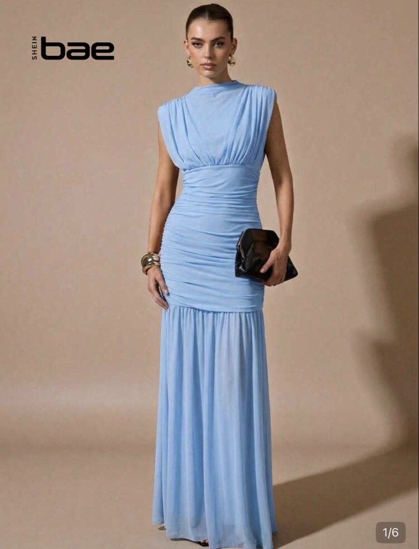 Maxi Blue Dress (Category: Dresses) located in Manila. Submitted by byaefinds (Listing ID 1470861786, Image 1). Description: - Used once - Brand: SHEIN bae - Size: M - Color: Light blue - Condition: Brand new with tags (unworn) - Design: High neck, sleeveless, ruched bodice and hips with a fitted silhouette, and a flowy chiffon skirt - Measurements: Waist 72 cm, Length 149 cm.