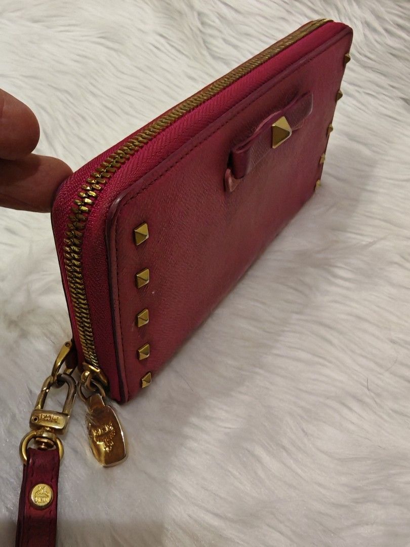 Mcm Continental Zip Around Leather Gold Studs Wallet (Category: Luxury Bags & Wallets) located in Manila. Submitted by xanderzluxcollection (Listing ID 1470890738, Image 2). Description: 🔴Authentic MCM hot pink leather continental zip- around wallet featuring a decorative bow accent and gold-tone pyramid studs👝 🔴Good Condition,No Inclusion 🔴Fb Acct.Xander M.Gatchalian.09606022191.
