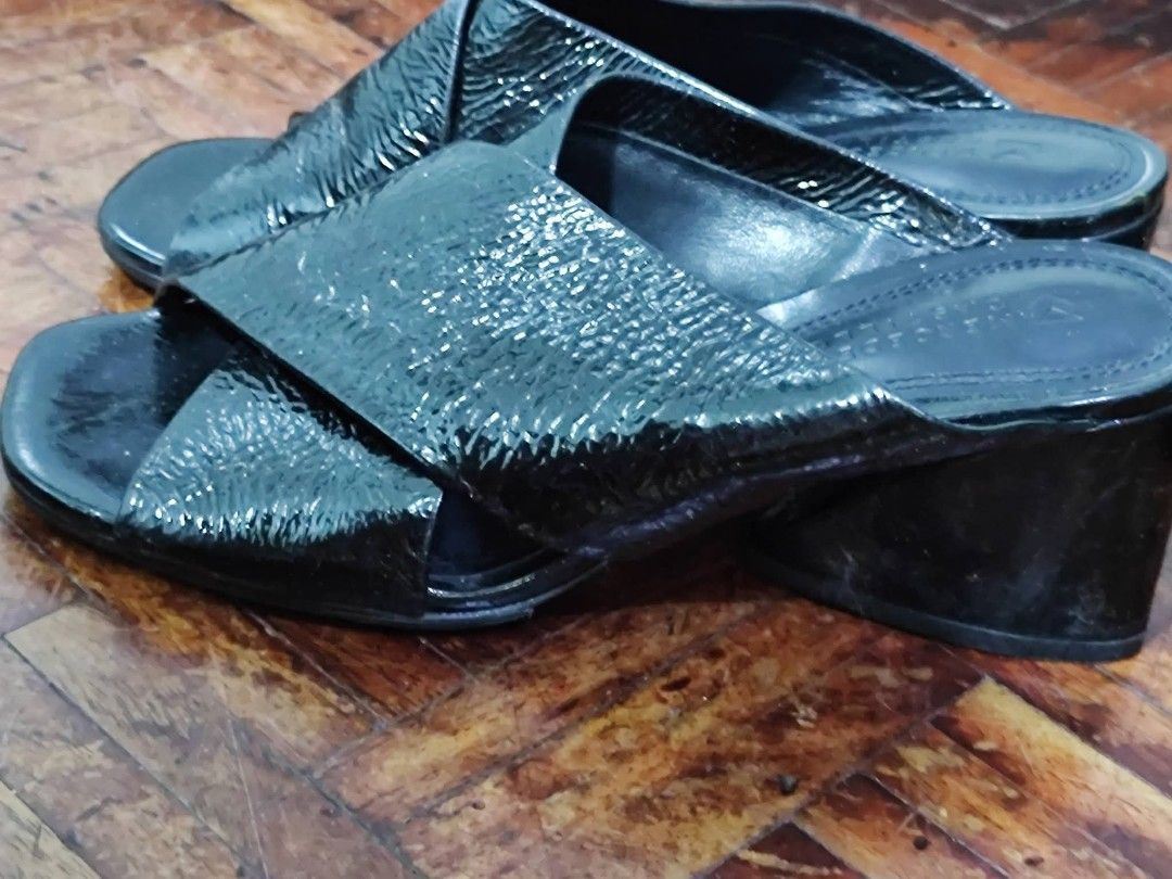 Mercedes Castillo Black Mules (Category: Flats & Sandals) located in Bacoor. Submitted by stargazer1084 (Listing ID 1470836374, Image 3). Description: - Brand: Mercedes Castillo - Style: Slip-on mules with chic square open toe - Design: Criss-cross textured straps across the top - Heel: Comfortable chunky block heel, easy to dress up or down - Comfort: Cushioned footbed with stamped logo for all-day wear - Versatility: Perfect for both work outfi
