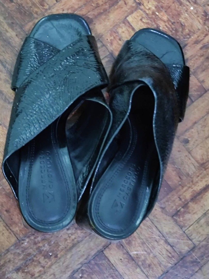 Mercedes Castillo Black Mules (Category: Flats & Sandals) located in Bacoor. Submitted by stargazer1084 (Listing ID 1470836374, Image 1). Description: - Brand: Mercedes Castillo - Style: Slip-on mules with chic square open toe - Design: Criss-cross textured straps across the top - Heel: Comfortable chunky block heel, easy to dress up or down - Comfort: Cushioned footbed with stamped logo for all-day wear - Versatility: Perfect for both work outfi