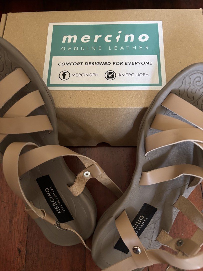 Mercino Genuine Leather Sandals Tan Strap Flat (Category: Flats & Sandals) located in Quezon City. Submitted by leahs.stuff (Listing ID 1470816298, Image 3). Description: - Brand: Mercino - Material: Genuine leather in versatile tan - Design: Strappy with secure adjustable ankle buckle - Comfort: Flat sole with textured grip underneath, perfect for everyday wear - Packaging: Includes original box and packaging.
