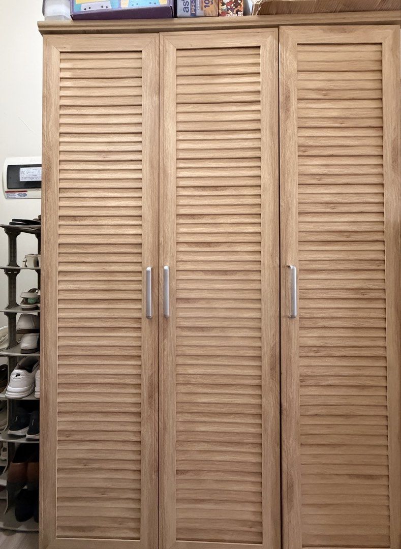 Metro Oak Wardrobe Cabinet SY-11191 (Category: Shelves, Cabinets & Racks) located in Taguig. Submitted by wandi08 (Listing ID 1470893985, Image 1). Description: Metro Home Center 3D oak wardrobe cabinet (Model SY-11191) - Beautiful wood grain finish with 3 slatted doors and modern vertical silver handles - Includes 1 built-in hanging rod for dresses and coats - Features a top shelf on the left side and multiple stacked shelves on the right for or