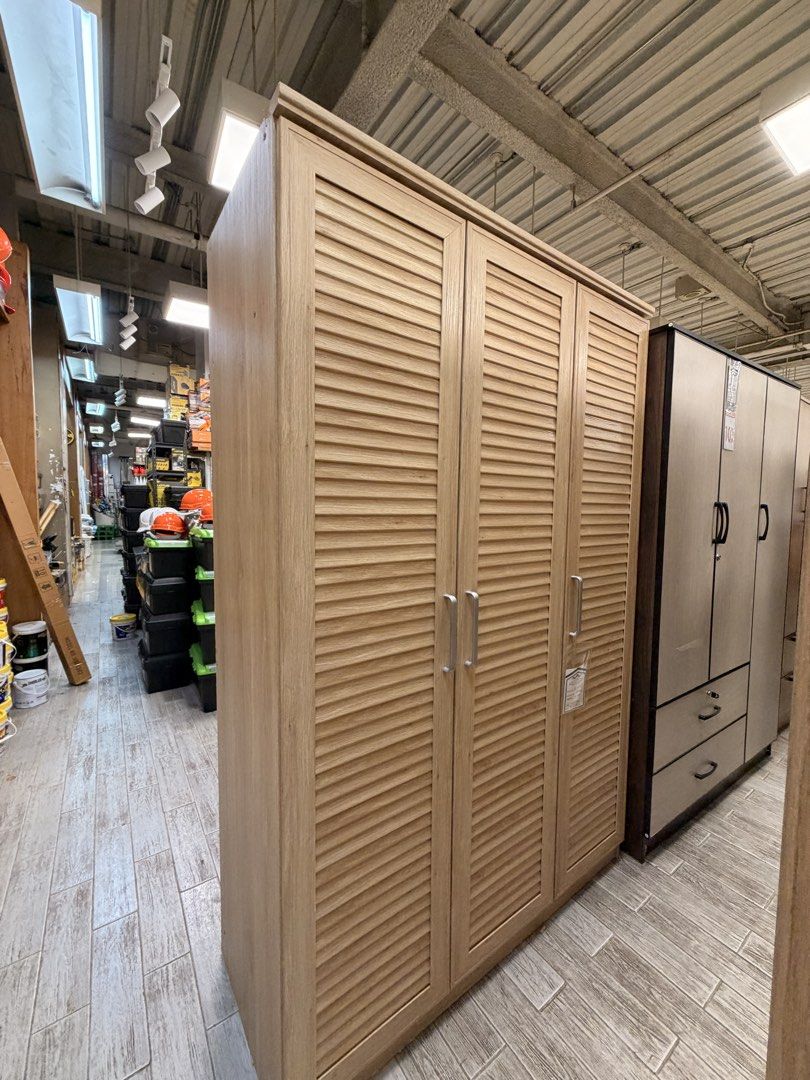 Metro Oak Wardrobe Cabinet SY-11191 (Category: Shelves, Cabinets & Racks) located in Taguig. Submitted by wandi08 (Listing ID 1470893985, Image 2). Description: Metro Home Center 3D oak wardrobe cabinet (Model SY-11191) - Beautiful wood grain finish with 3 slatted doors and modern vertical silver handles - Includes 1 built-in hanging rod for dresses and coats - Features a top shelf on the left side and multiple stacked shelves on the right for or